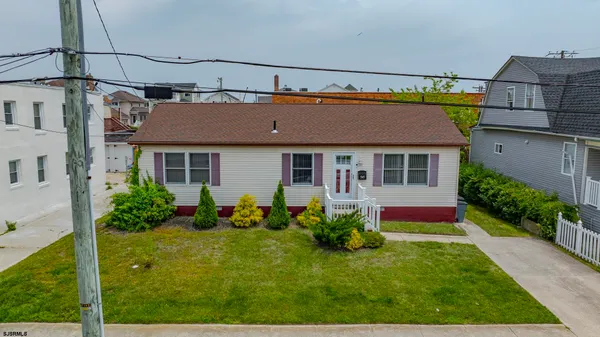 an aerial view of a house with a garden