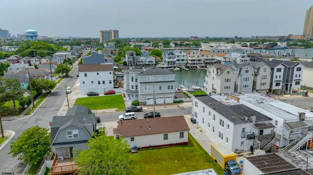 a aerial view of a house with table and chairs in patio