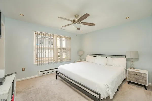 a bedroom with a bed and a view of bathroom