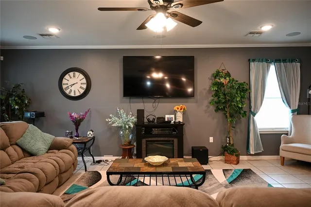 a bedroom with a large bed and a book shelf