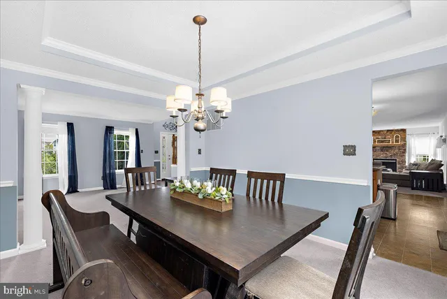 a view of a livingroom with furniture and a window