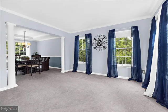 a bedroom with a bed dresser and a window