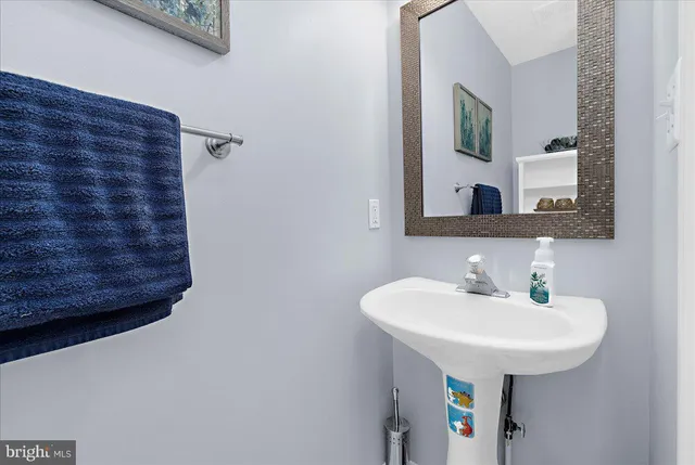 a bathroom with a bathtub a shower a sink and a window