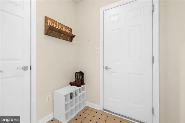 a spacious bathroom with a double vanity sink a large mirror and a bathtub