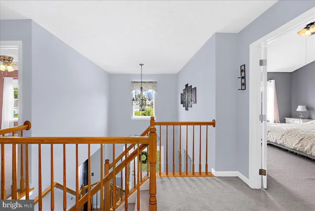 a spacious bathroom with a sink a toilet and a mirror