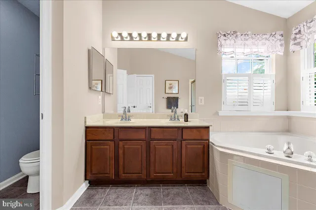 an empty room with a empty space and chandelier fan