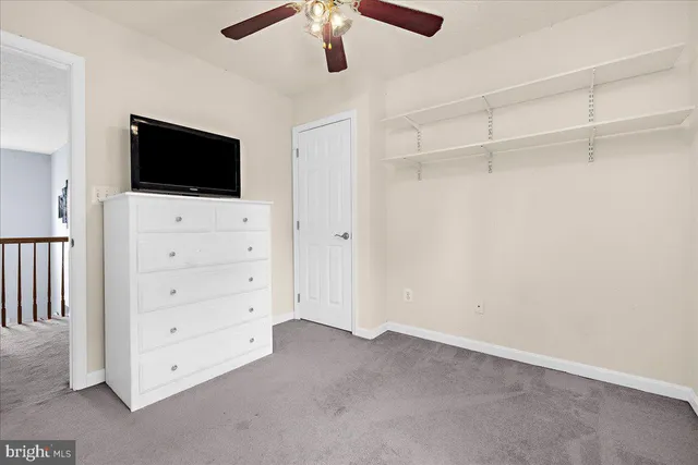 a view of a livingroom with furniture and a flat screen tv