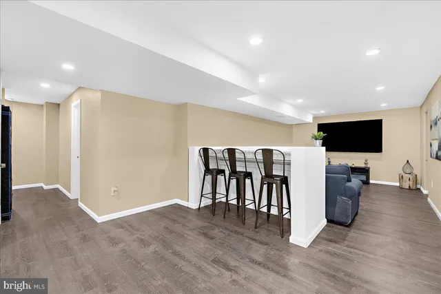 a bathroom with a toilet a sink a vanity and mirror