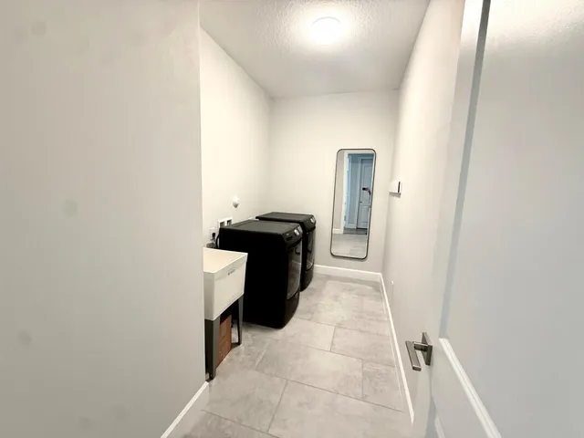 a view of a utility room with washer and dryer