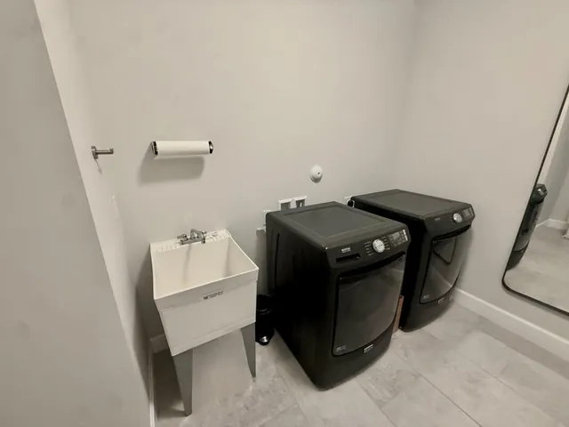 a utility room with dryer and washer