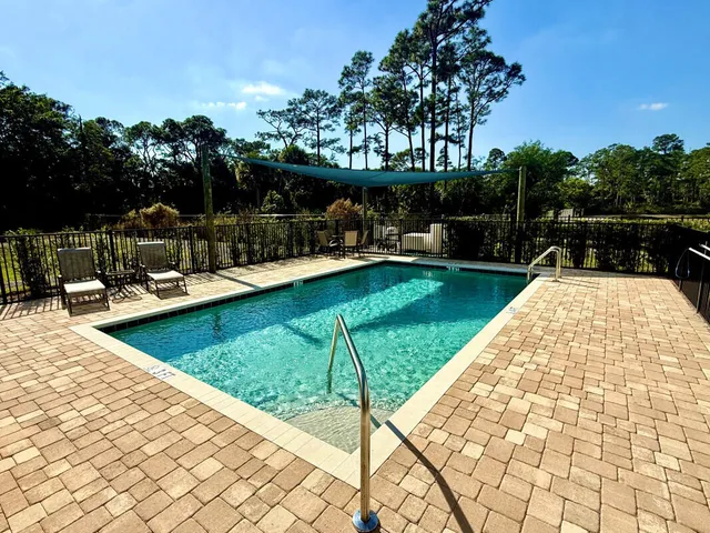 a view of a swimming pool with a patio