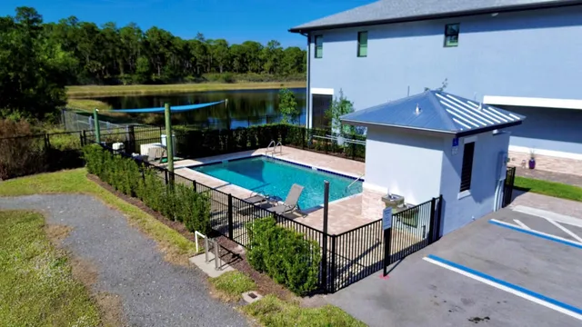 an aerial view of a house with outdoor space