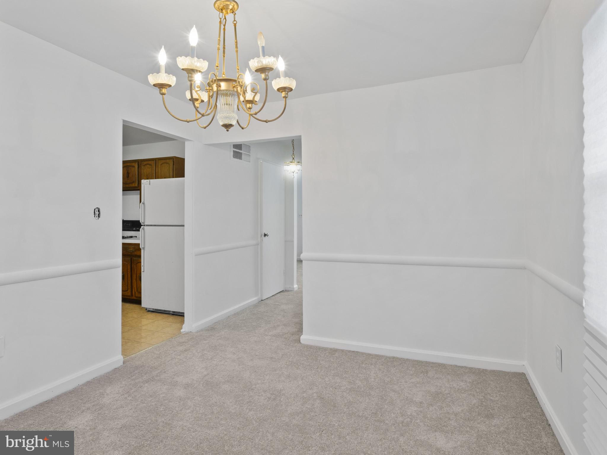 4008 24th Place Temple Hills, MD 20748 - Photo 11 of 31 a view of a chandelier in big room