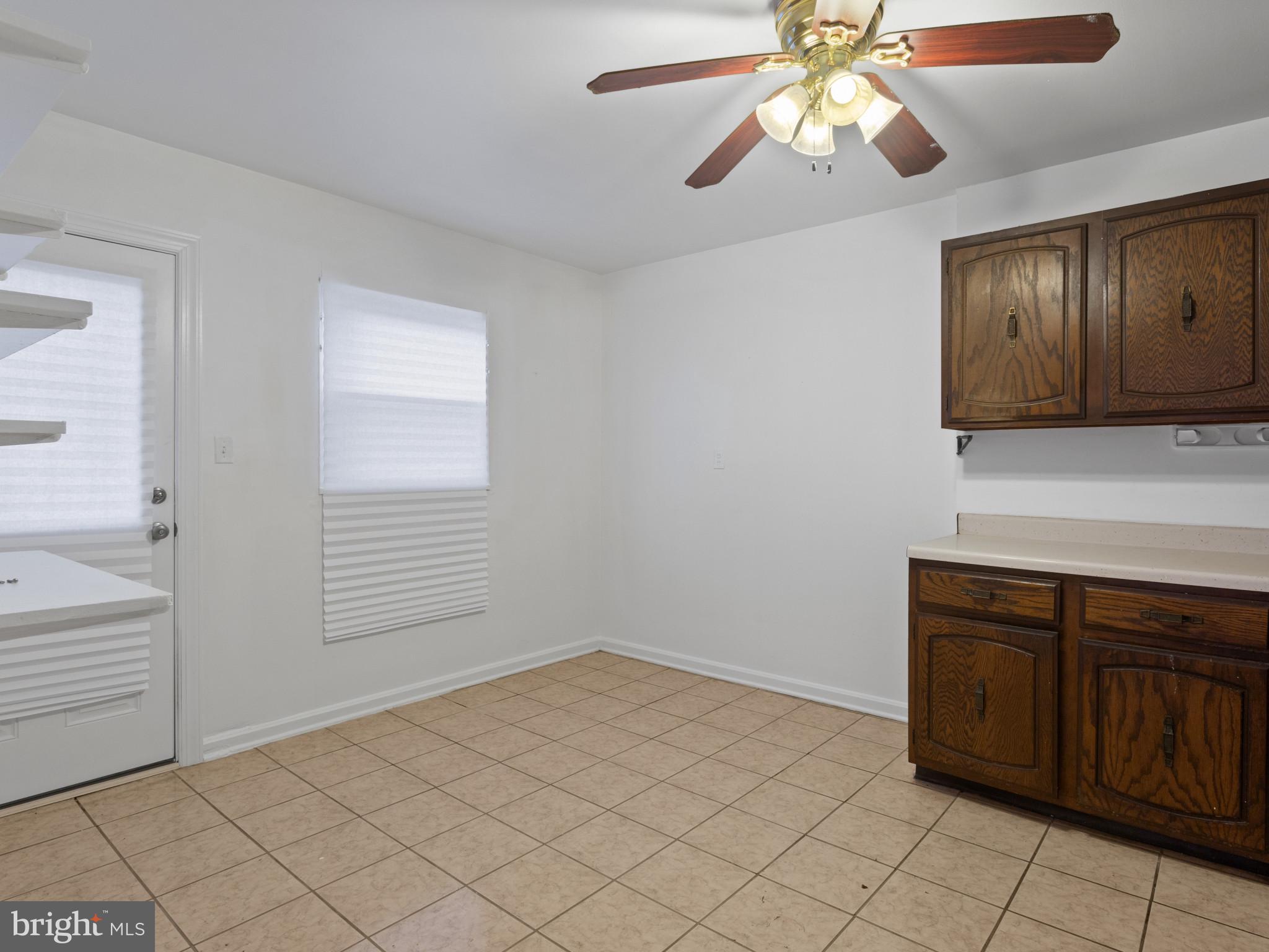 4008 24th Place Temple Hills, MD 20748 - Photo 13 of 31 a view of a kitchen with a sink cabinets and a window