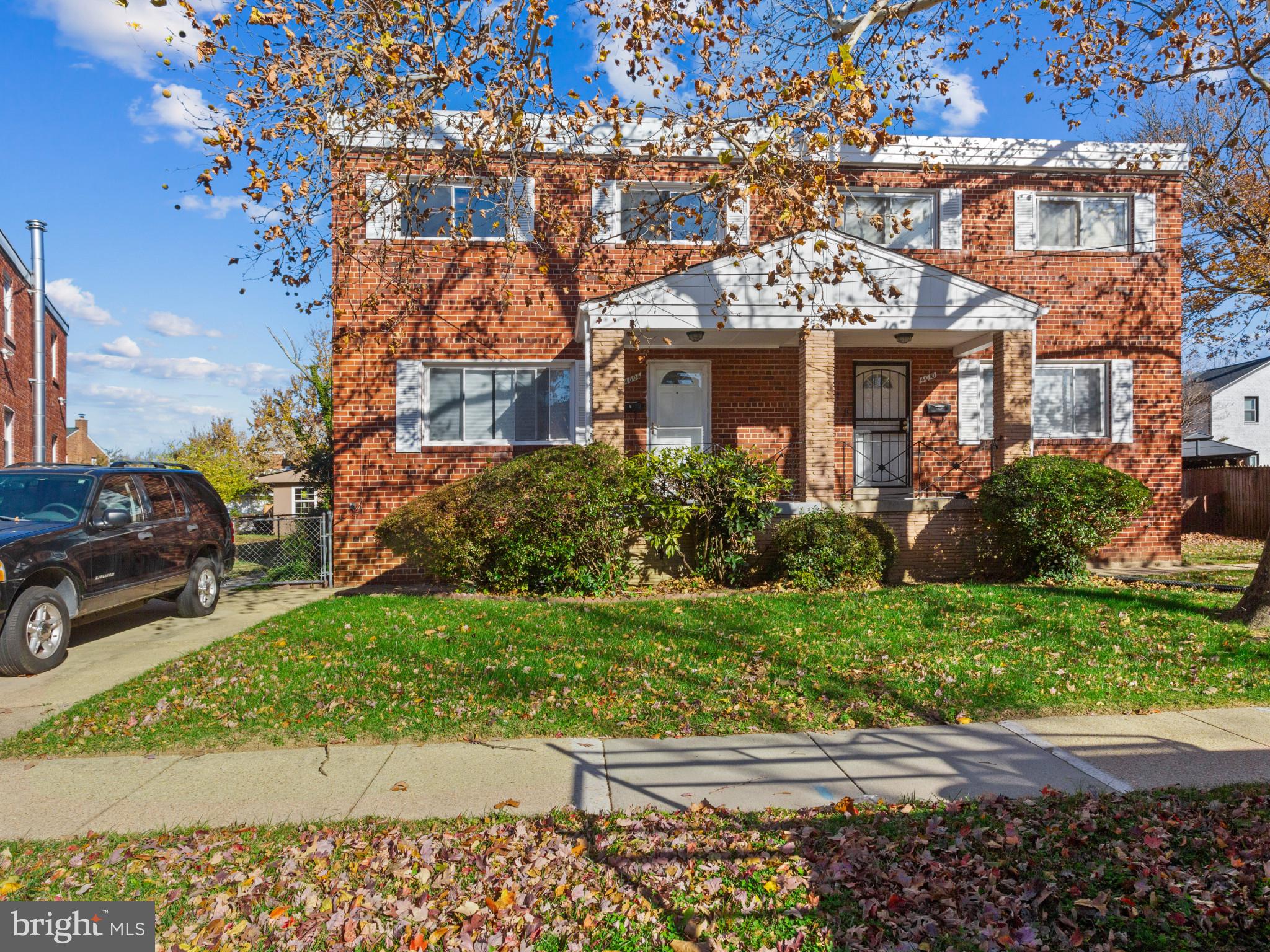 4008 24th Place Temple Hills, MD 20748 - Photo 2 of 31 a front view of a house with a garden