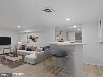 4008 24th Place Temple Hills, MD 20748 - Photo 28 of 31 a living room with furniture and a flat screen tv