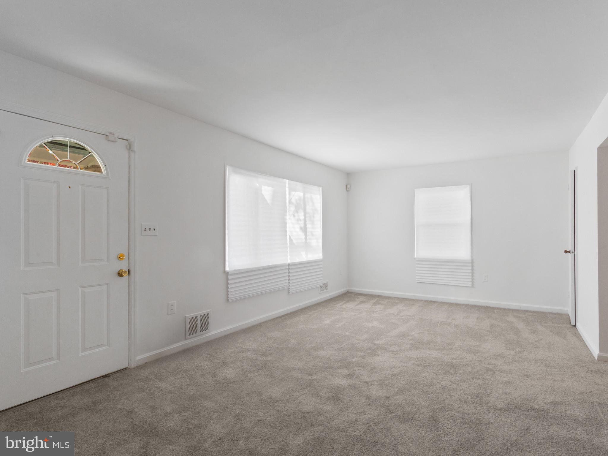 4008 24th Place Temple Hills, MD 20748 - Photo 4 of 31 an empty room with windows