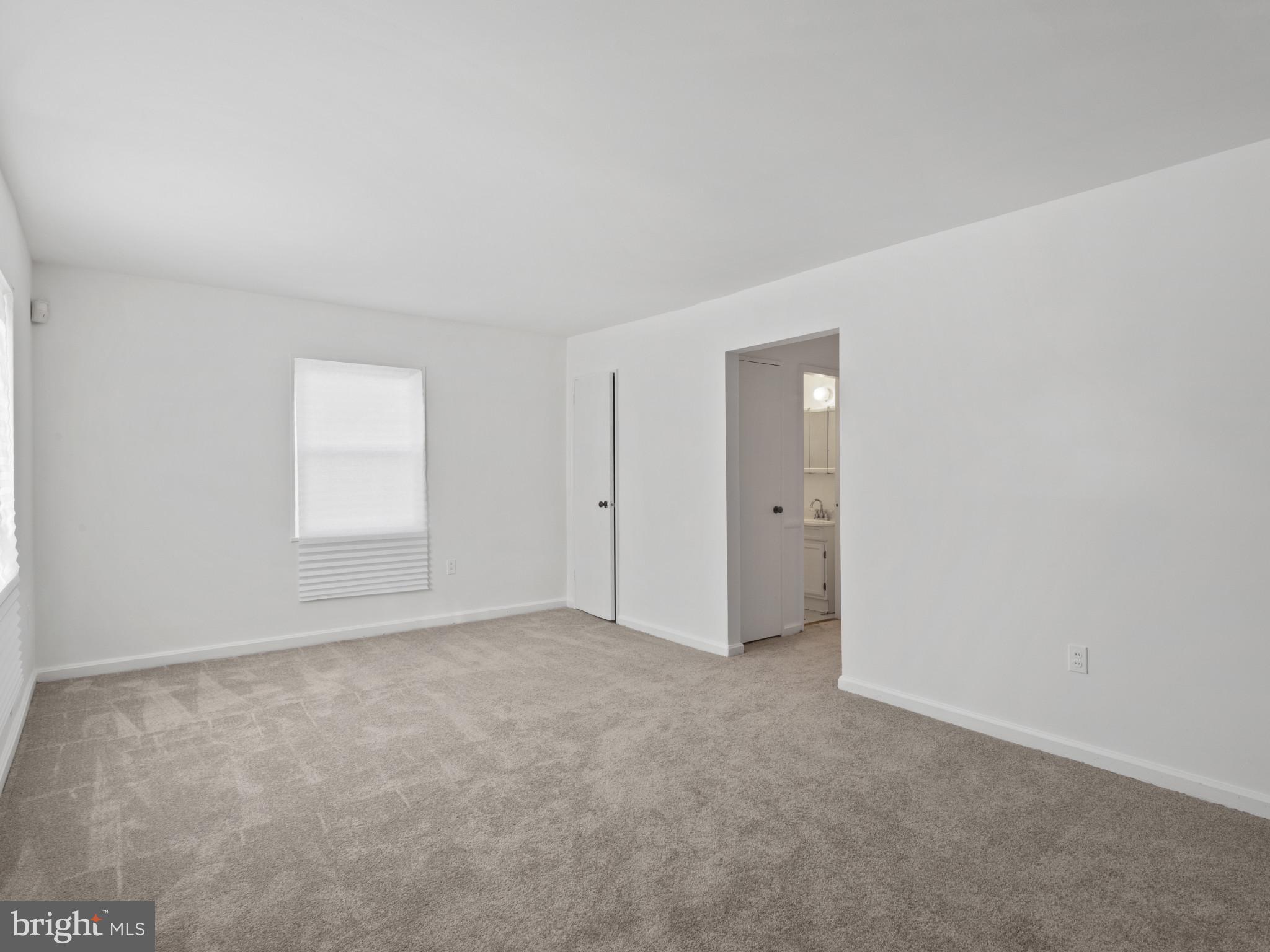 4008 24th Place Temple Hills, MD 20748 - Photo 7 of 31 a view of an empty room with a window