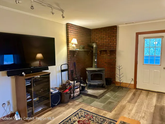 a bedroom with a bed lamp and a window