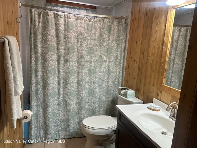 a outdoor living space with furniture and a rug