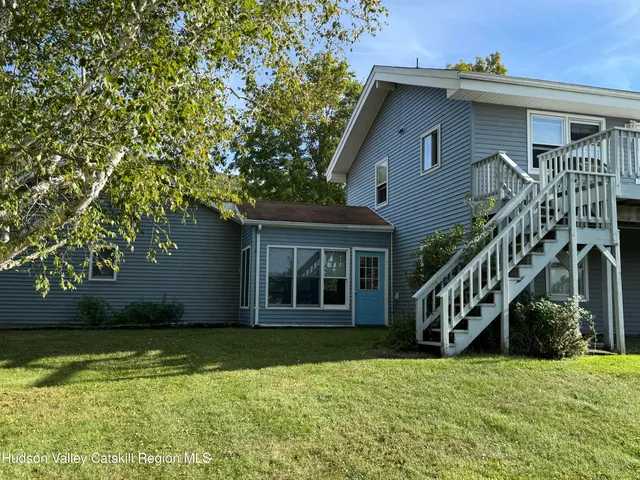 a house with trees in the background
