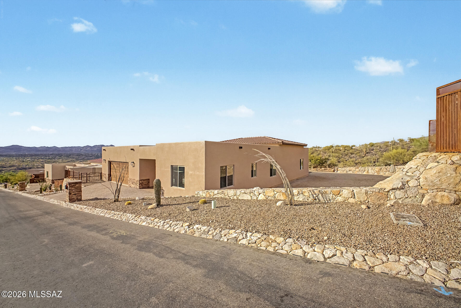 2399 Della Roccia Court Tucson, AZ 85737 - Photo 2 of 34 a view of a building with a road