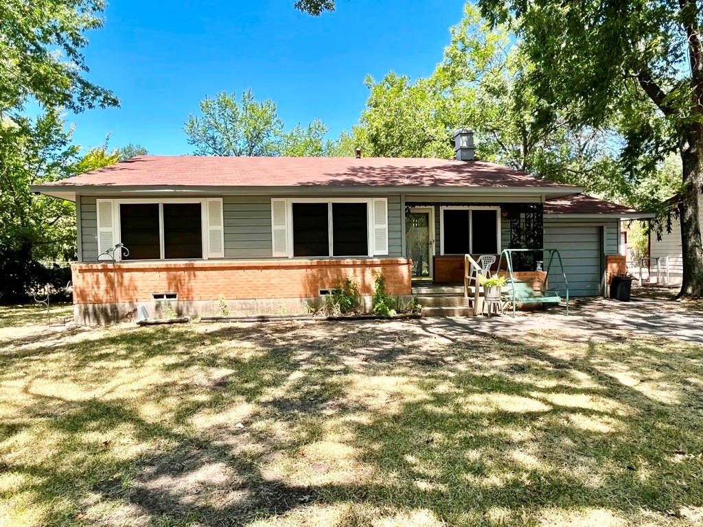 a front view of a house with a patio