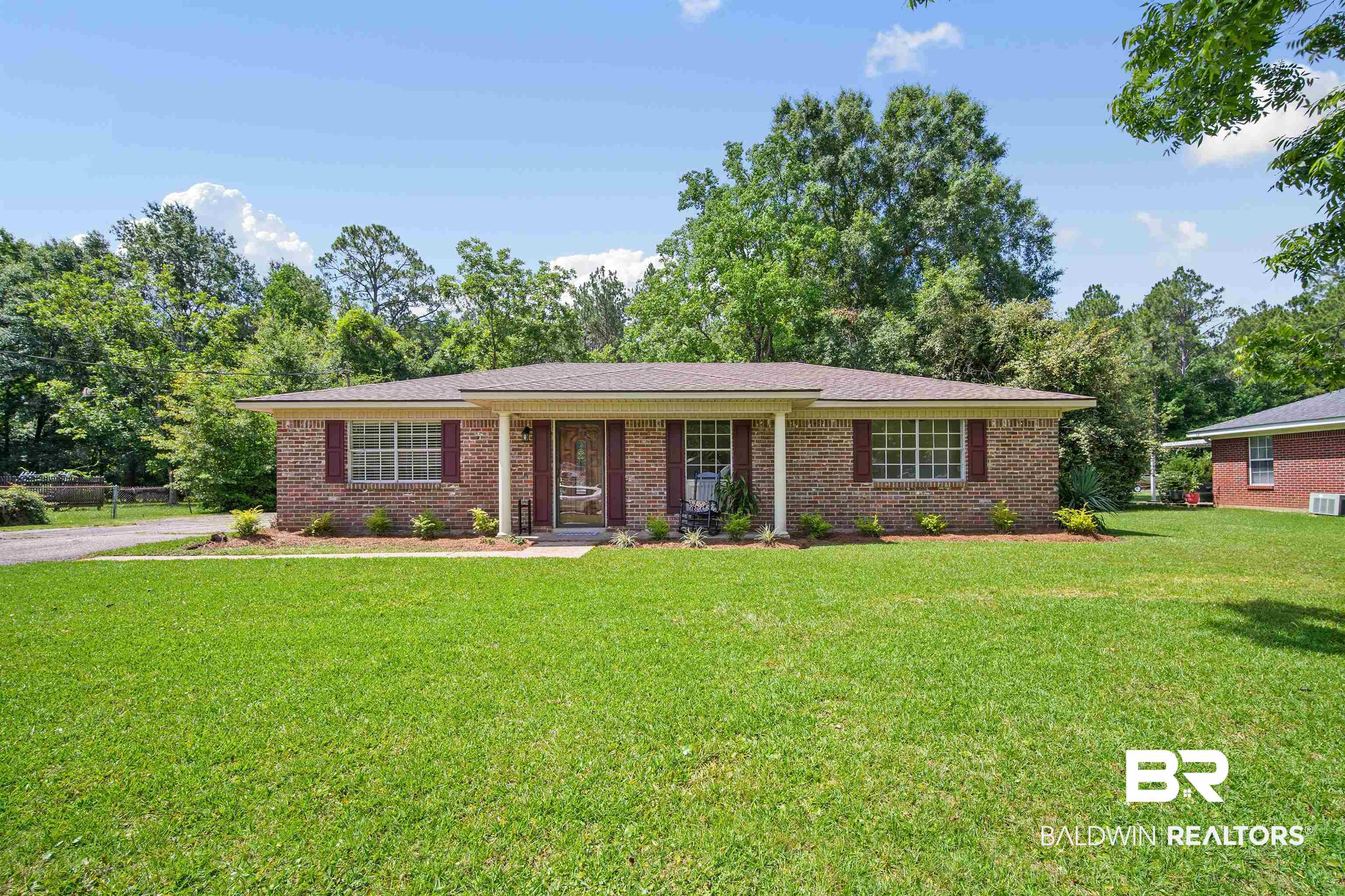 1325 Pawnee Circle Saraland, AL 36571 - Photo 1 of 26 Single story home with a front lawn and brick siding