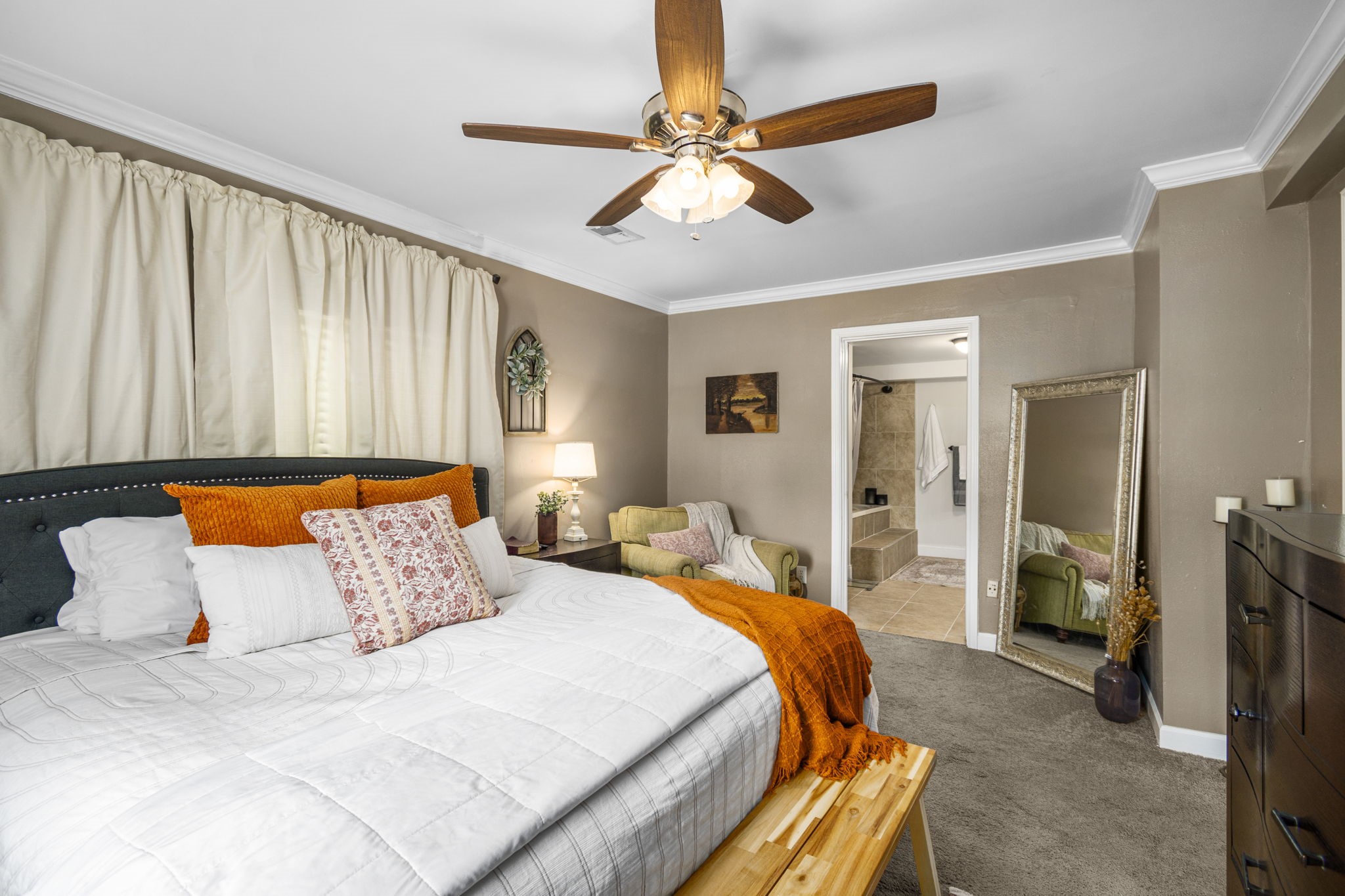 25311 Hardin Store Road Pinehurst, TX 77362 - Photo 13 of 39 a bedroom with bed and a chandelier