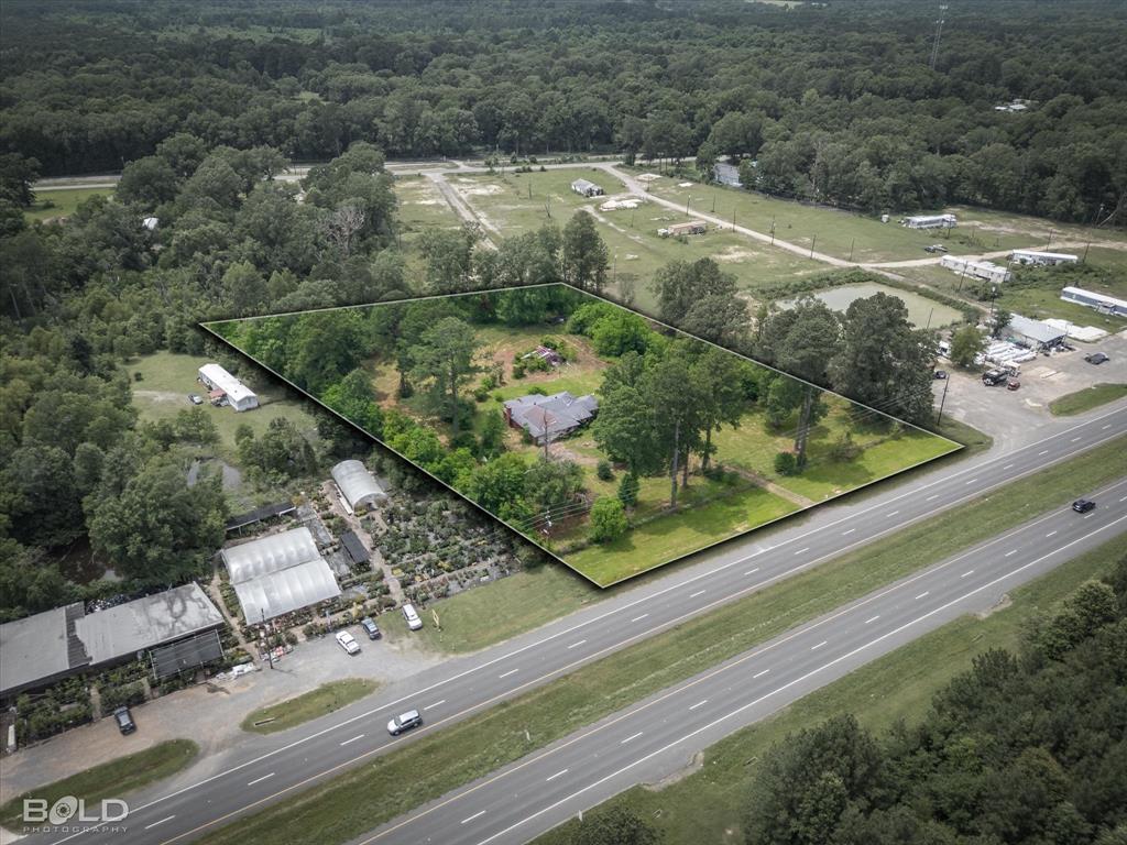 12274 Mansfield Road Keithville, LA 71047 - Photo 2 of 11 a view of a yard with an outdoor space