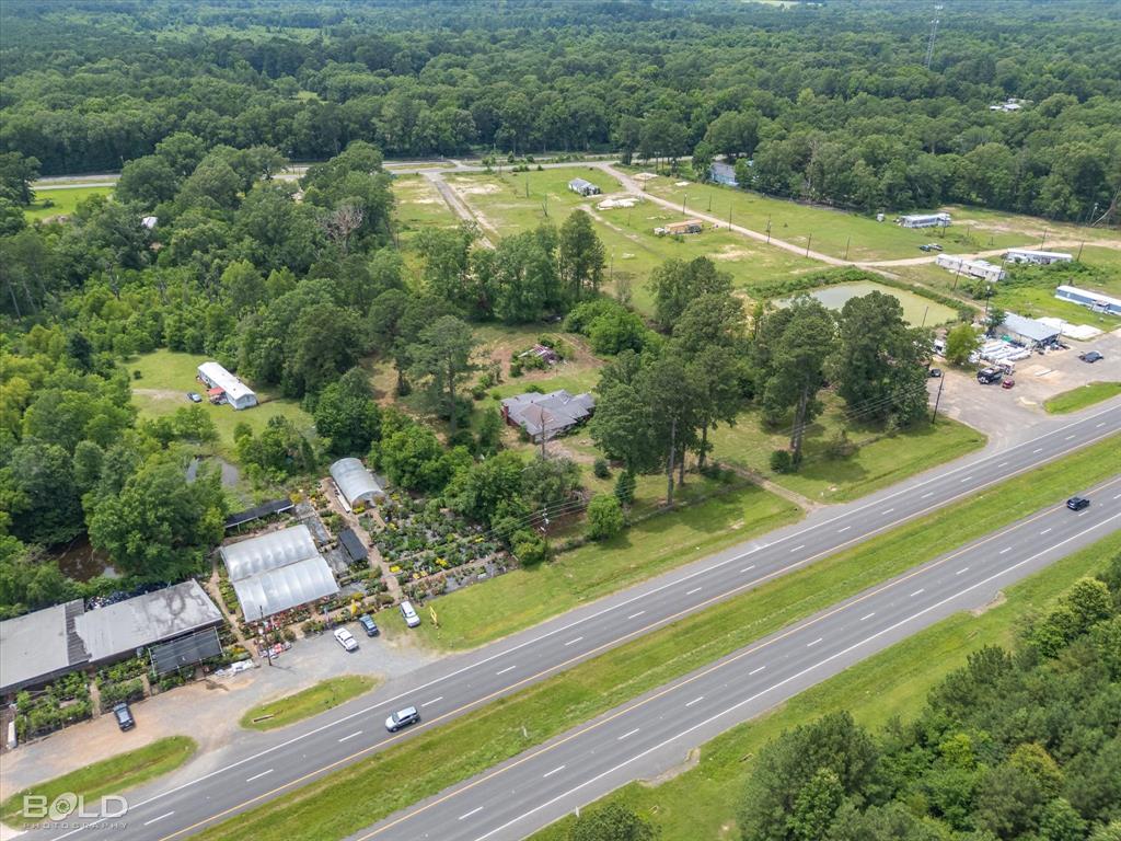 12274 Mansfield Road Keithville, LA 71047 - Photo 3 of 11 an aerial view of residential houses with outdoor space and street view