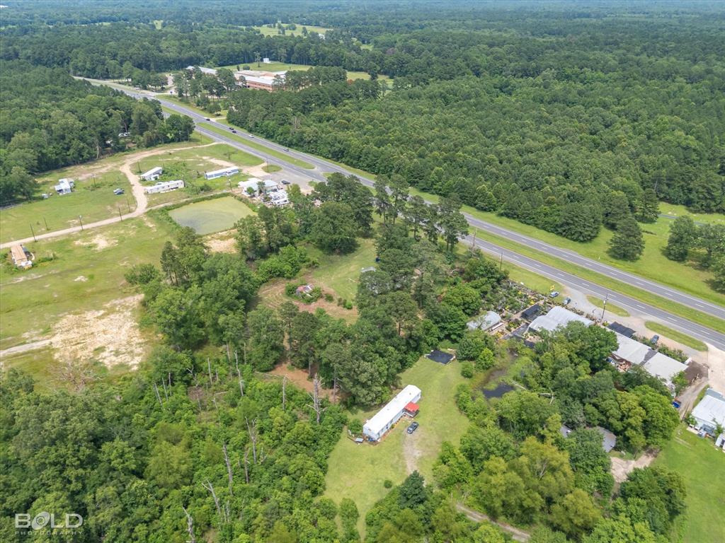 12274 Mansfield Road Keithville, LA 71047 - Photo 10 of 11 a view of a lake with a yard