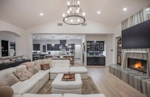 a kitchen with stainless steel appliances granite countertop a sink stove and cabinets