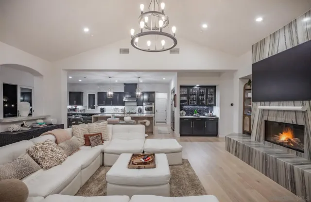 a bedroom with a bed dresser and window