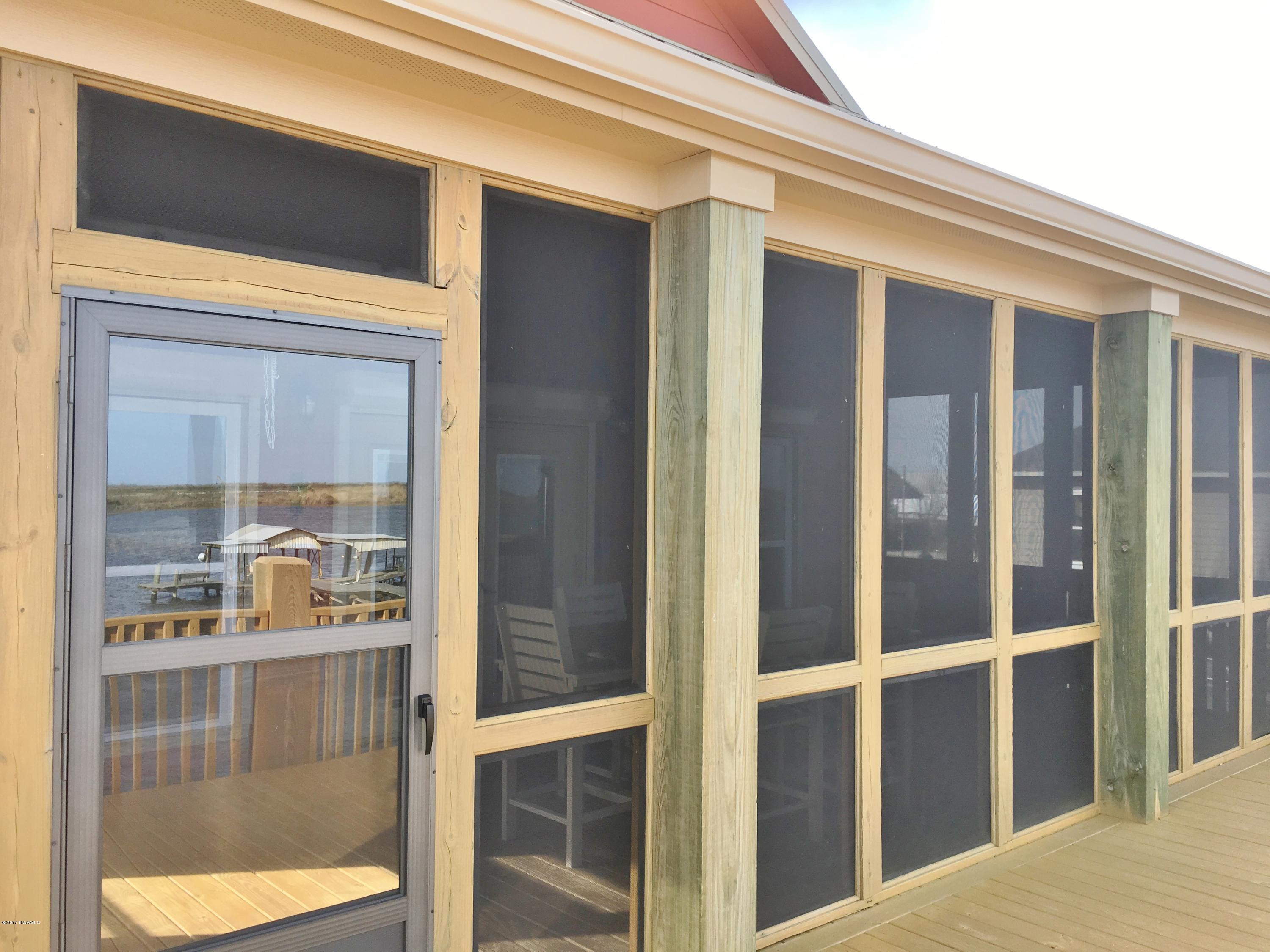 551 Lake Breeze Road Hackberry, LA 70645 - Photo 5 of 36 Covered Patio Entry