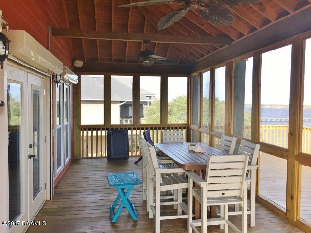 551 Lake Breeze Road Hackberry, LA 70645 - Photo 6 of 36 Screened Patio