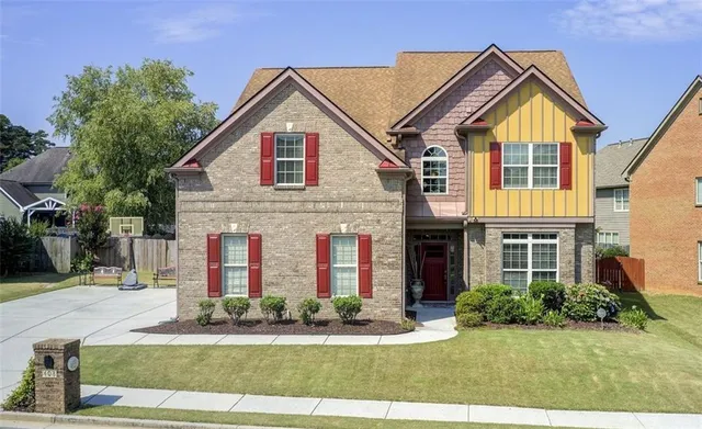 a front view of a house with garden