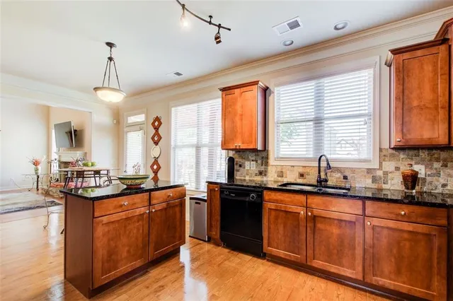 a view of an outdoor sitting area with furniture and umbrella