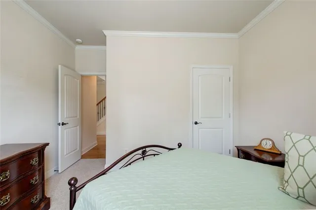 a bed room with a bed and a dresser