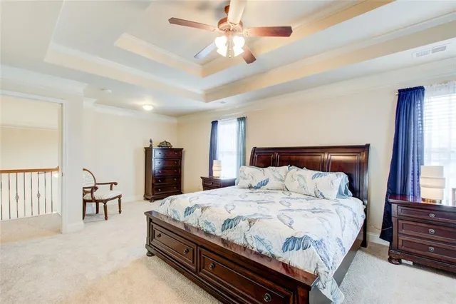 a spacious bathroom with a granite countertop sink mirror and shower