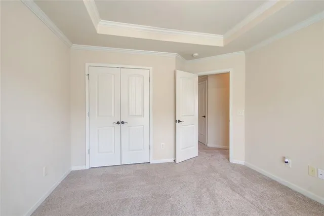 a view of a house with a small yard and plants