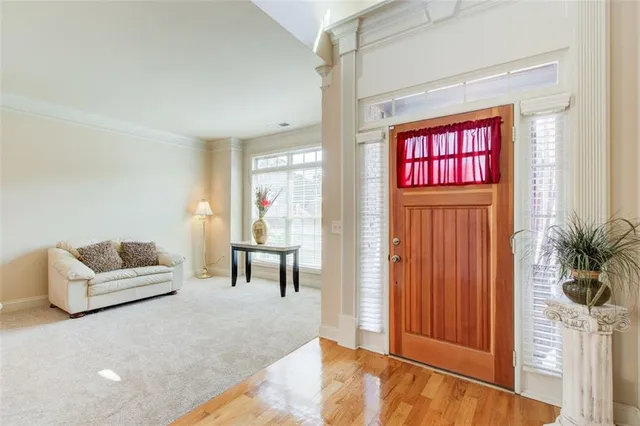 a dining room with furniture and a chandelier