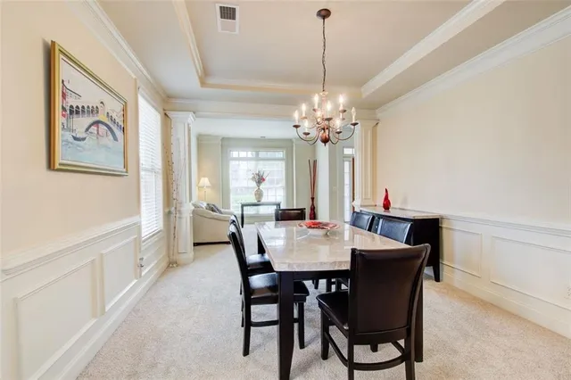 a kitchen with stainless steel appliances granite countertop a refrigerator a stove and a sink