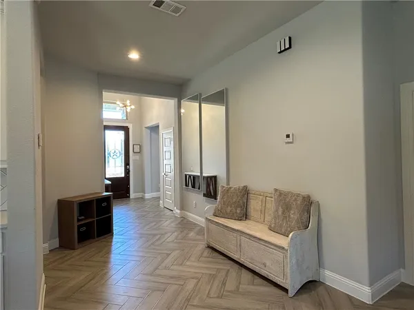 a kitchen with stainless steel appliances granite countertop a stove a sink a refrigerator and a microwave