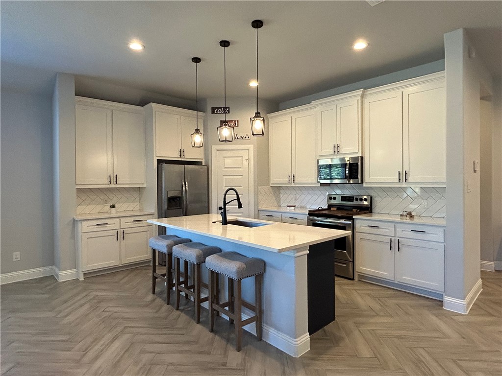 16664 County Road 3120 Road Northwest Purdon, TX 76679 - Photo 12 of 59 a kitchen with stainless steel appliances granite countertop a stove a sink a refrigerator and a microwave