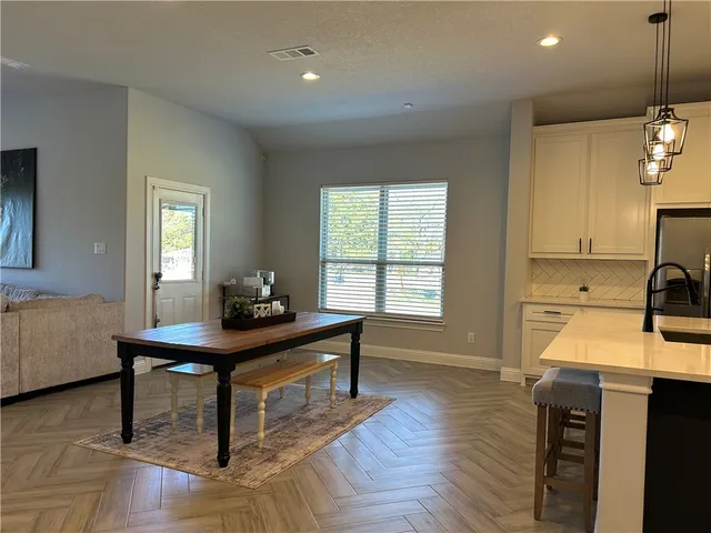 a view of livingroom with hardwood and hallway