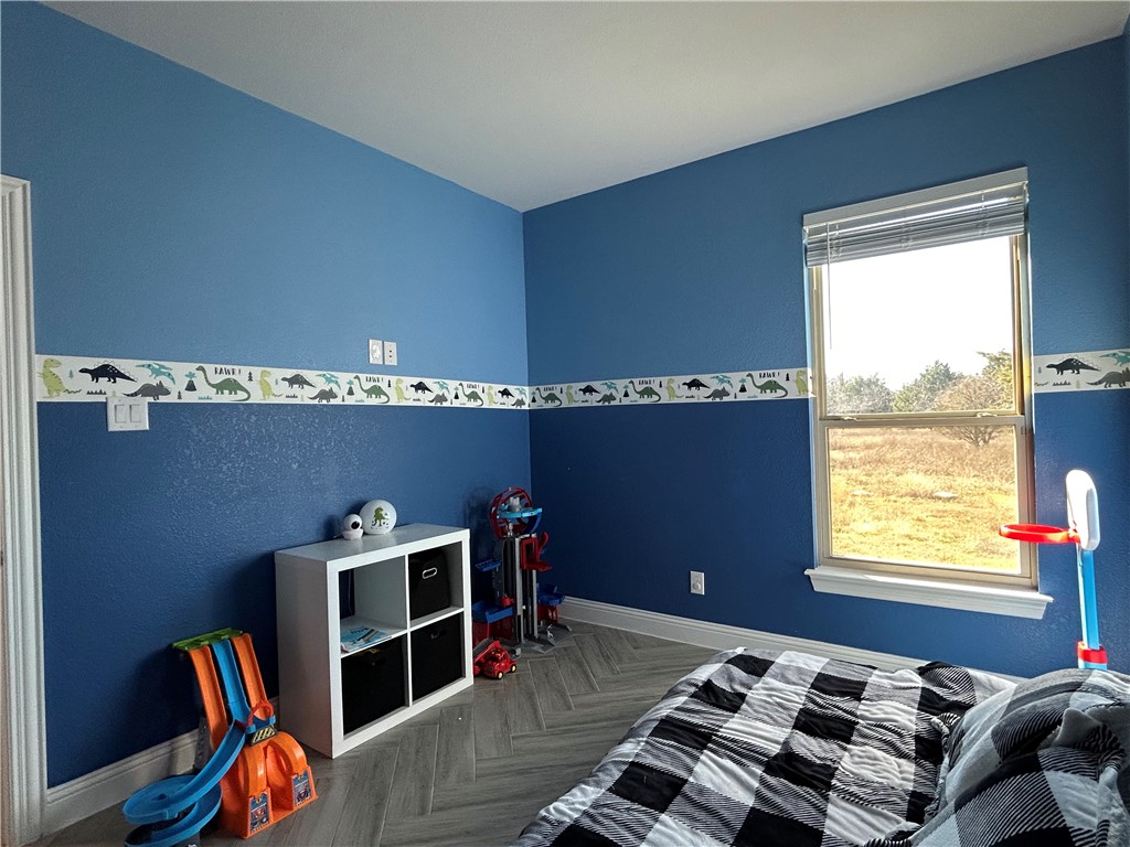 16664 County Road 3120 Road Northwest Purdon, TX 76679 - Photo 24 of 59 a bedroom with furniture and a window