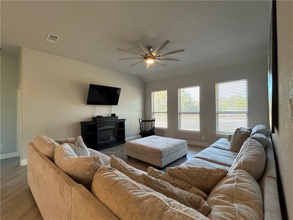 16664 County Road 3120 Road Northwest Purdon, TX 76679 - Photo 32 of 59 a living room with furniture a ceiling fan and a window