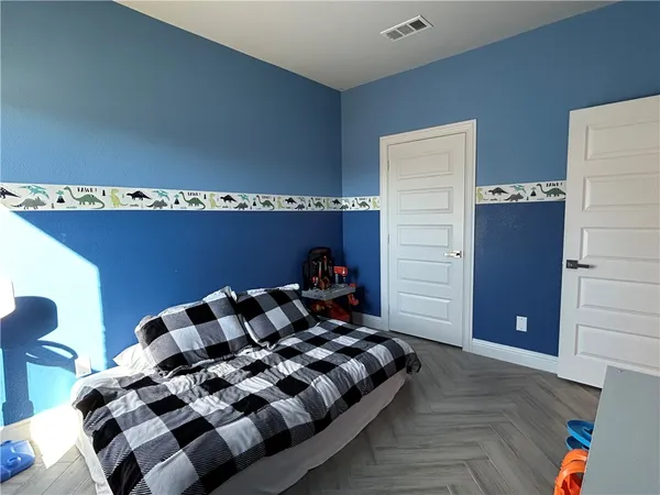 a bathroom with a sink toilet vanity and shower