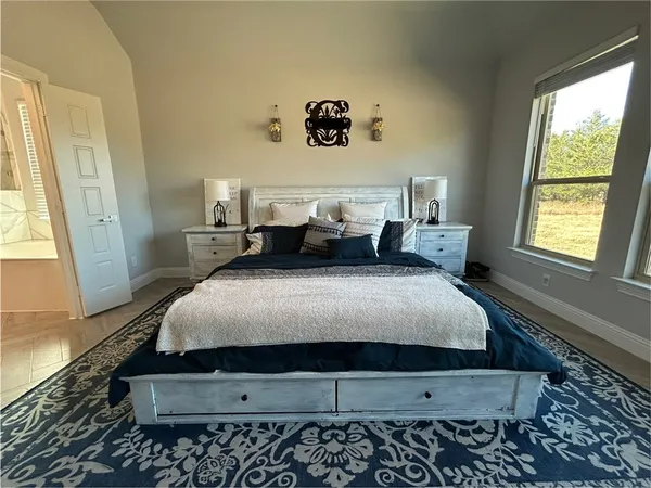 a bed room with a bed and a couch